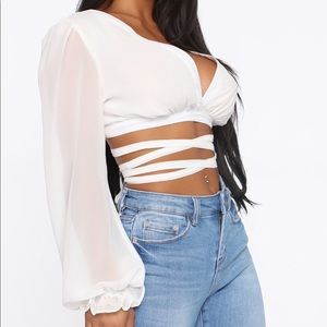 Long sleeve tie up crop top from FASHIONNOVA